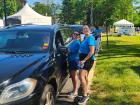 Drive-thru volunteers at the St. Nectarios Greek Fest in Palatine