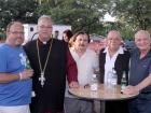 Church leader with volunteer and guests - St. Sophia Greekfest, Elgin Church leader with volunteer and guests - St. Sophia Greekfest, Elgin