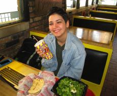 Loyal customer enjoying lunch at Burger Baron Restaurant in Chicago
