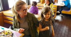 Family enjoying lunch at Charcoal Delights in Des Plaines
