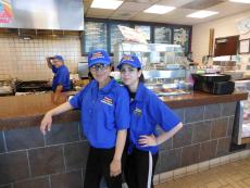 Friendly staff at Charcoal Delights Restaurant in Chicago