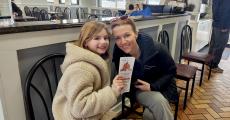 Mom and daughter getting carryout at Charcoal Flame Grill in Morton Grove
