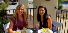 Friends enjoying outdoor lunch at Dino's Cafe in Bloomingdale