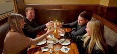 Friends enjoying dinner at Ellwood Steak and Fish House in DeKalb