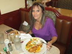 Loyal patron enjoying breakfast at Omega Restaurant in Downers Grove Loyal patron enjoying breakfast at Omega Restaurant in Downers Grove