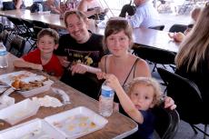 Family enjoying the Oak Lawn Greek Fest at St. Nicholas Greek Orthodox Church