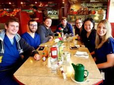 Friends enjoying breakfast at Omega Restaurant & Pancake House in Downers Grove