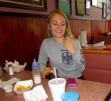 Happy customer enjoying lunch at Twins Gyros in Harwood Heights